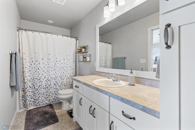 bathroom with vanity, toilet, and a shower with curtain