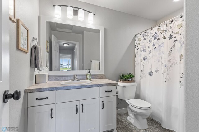 bathroom featuring vanity and toilet