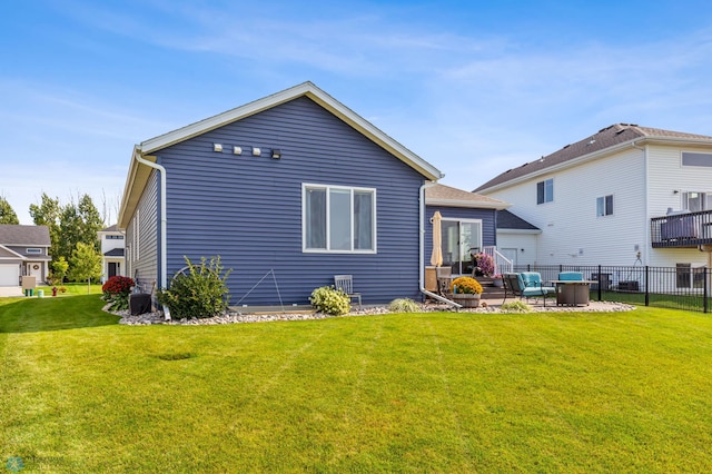 back of property with a patio and a yard