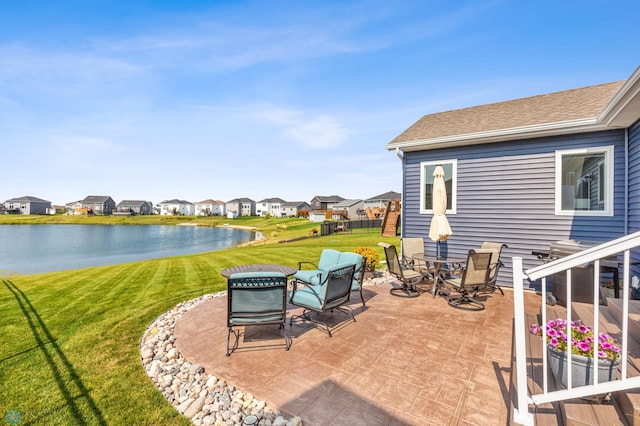 view of patio / terrace with a water view