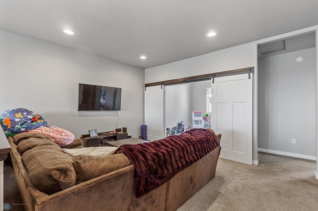 living room featuring light colored carpet and a barn door