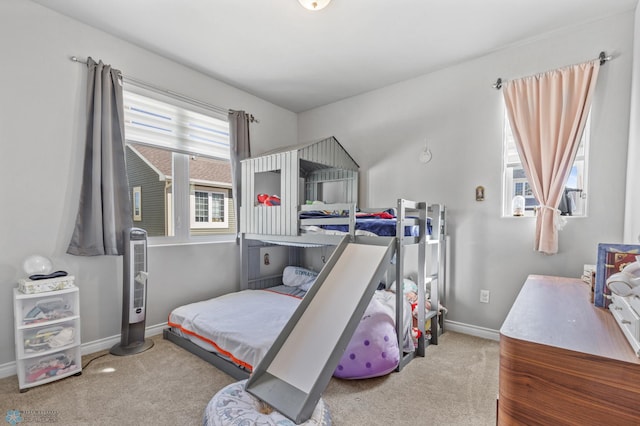 bedroom featuring light carpet