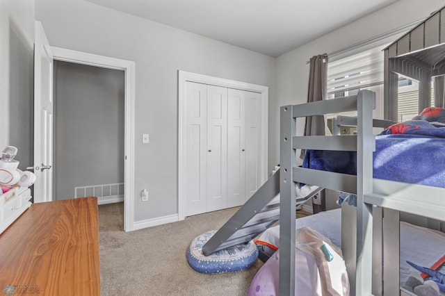 bedroom with carpet floors and a closet