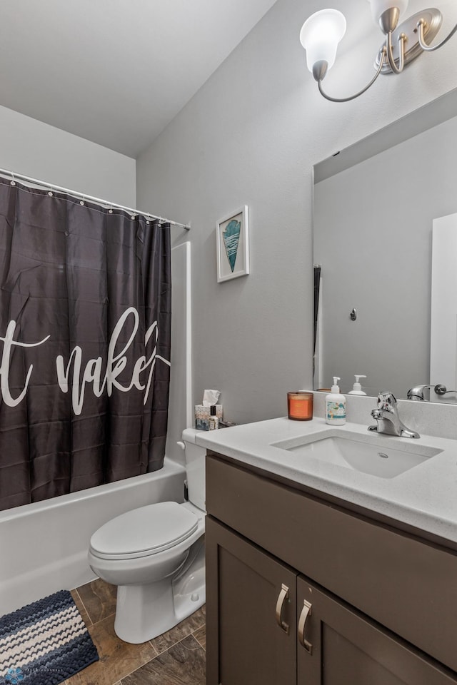 full bathroom with shower / bath combo, vanity, and toilet