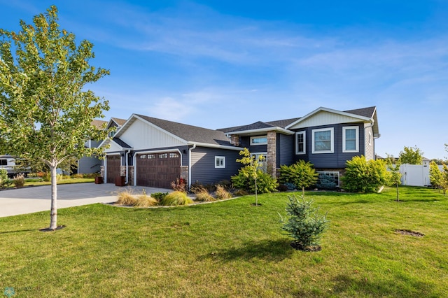 view of front of house with a garage and a front lawn