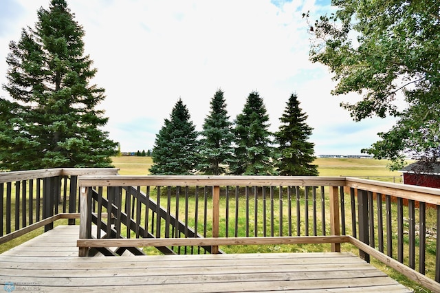 wooden deck with a lawn