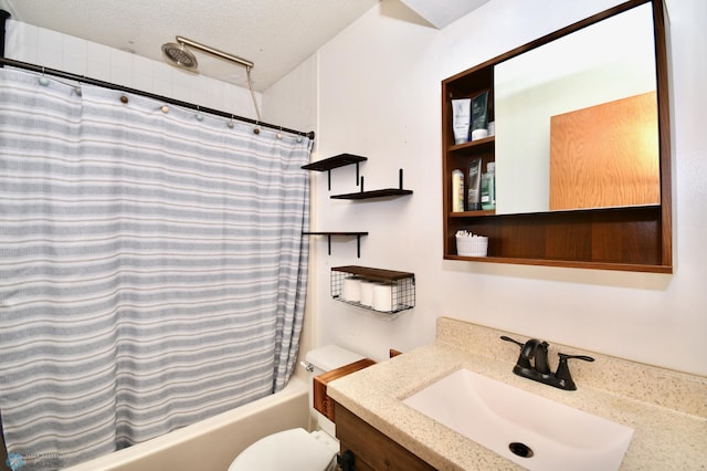 full bathroom featuring vanity, a textured ceiling, shower / bath combo with shower curtain, and toilet