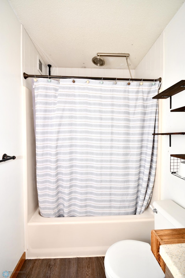 full bathroom with vanity, toilet, and shower / bath combination with curtain