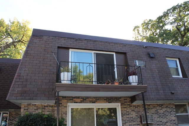 view of side of home with a balcony