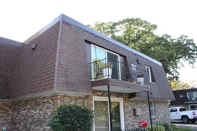 view of property exterior featuring a balcony