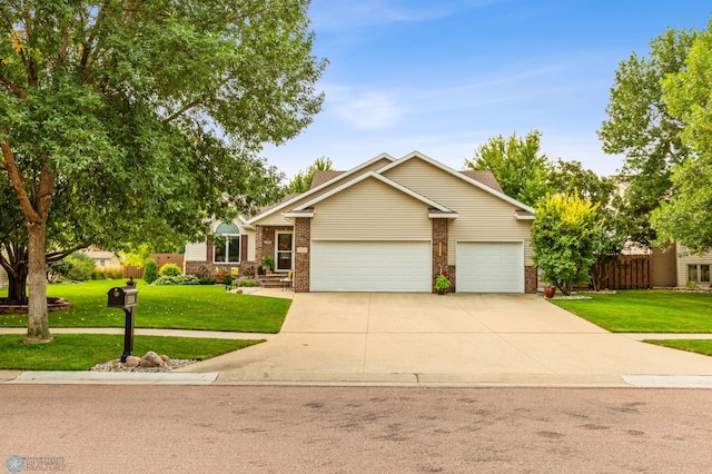 view of front of home with a front lawn and a garage