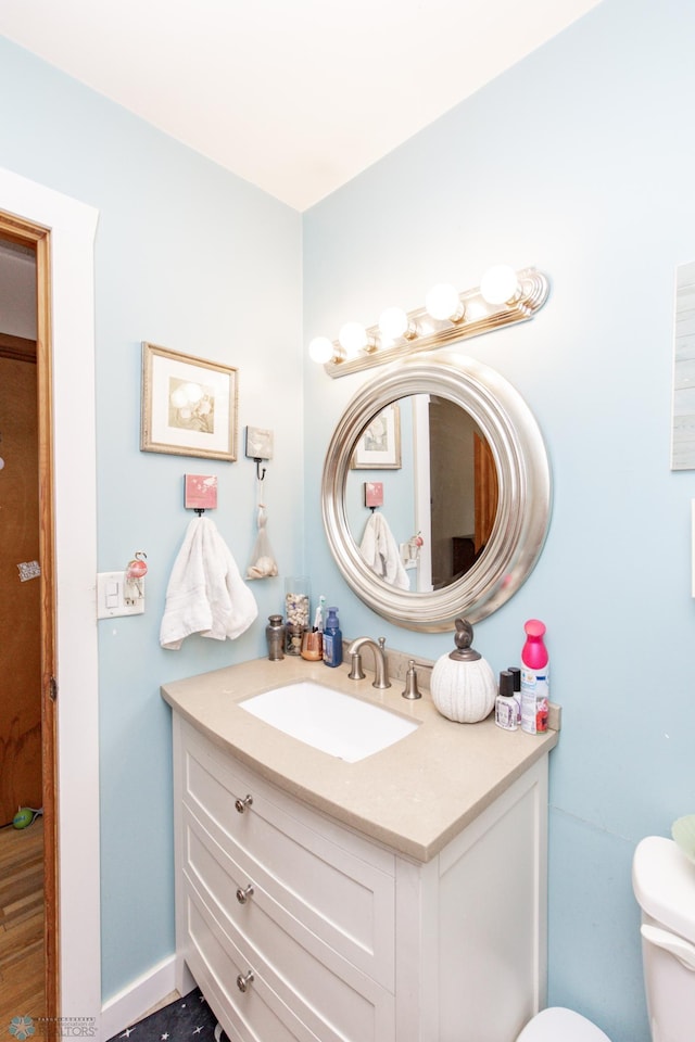 bathroom with vanity and toilet