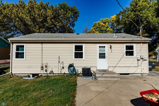 back of house featuring a patio, a yard, and cooling unit