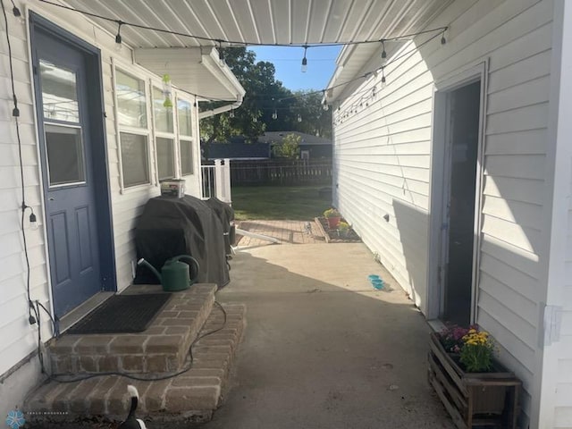 view of patio featuring a grill