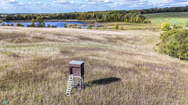 bird's eye view with a rural view and a water view