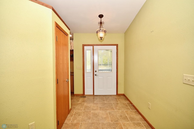 entryway with light tile patterned floors