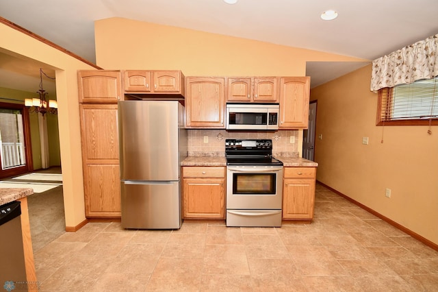 kitchen featuring appliances with stainless steel finishes, vaulted ceiling, tasteful backsplash, light brown cabinets, and an inviting chandelier