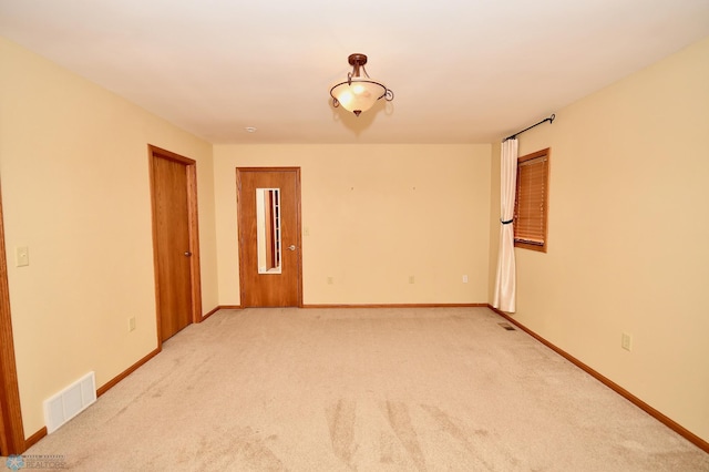 spare room featuring carpet