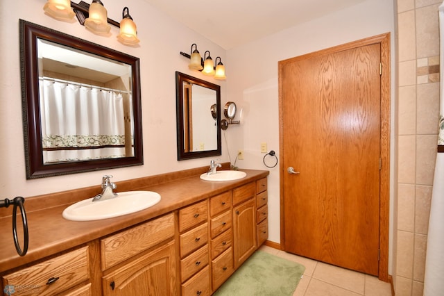 bathroom with tile patterned floors and vanity