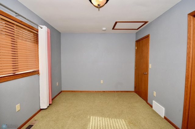 empty room with light colored carpet