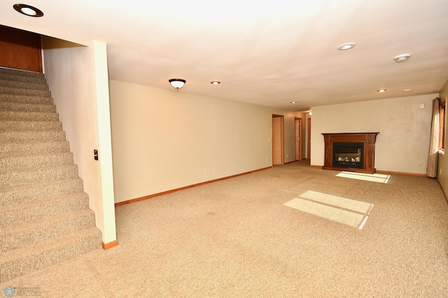 unfurnished living room featuring carpet