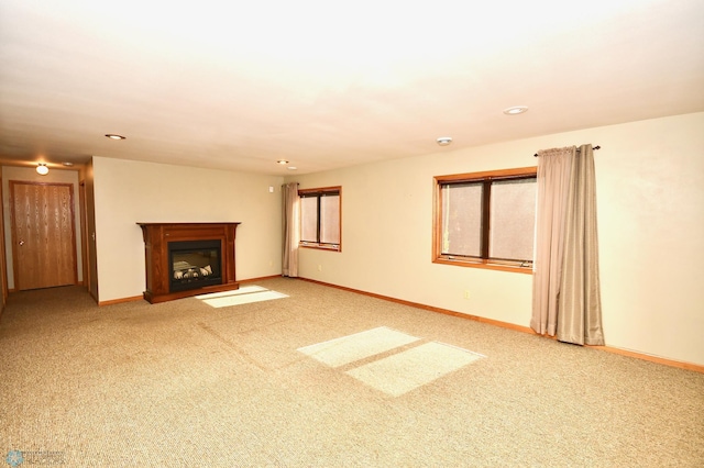 unfurnished living room with carpet floors