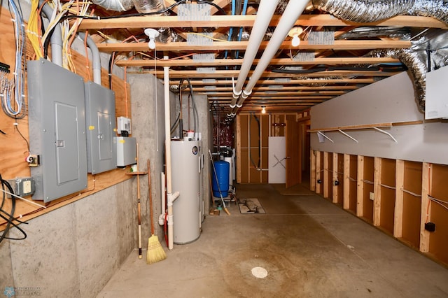 basement featuring gas water heater and electric panel