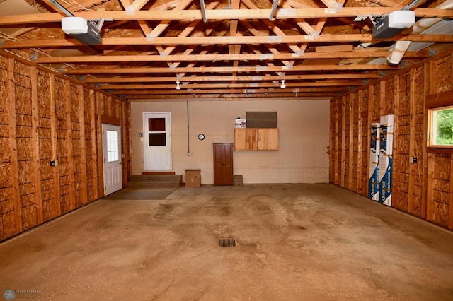 garage featuring a garage door opener