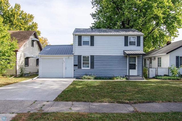 view of property featuring a front yard and a garage