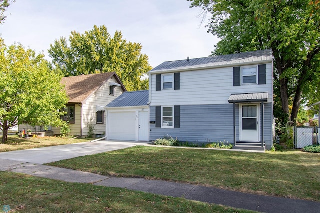 view of front of house with a garage and a front lawn