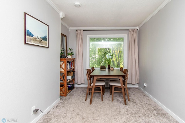 dining space with light carpet and ornamental molding