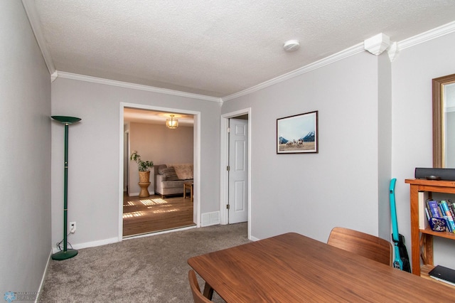 office space featuring a textured ceiling, carpet flooring, and ornamental molding