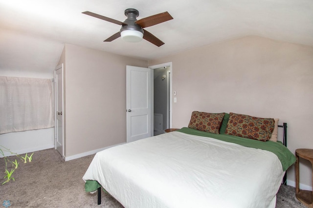 bedroom featuring ceiling fan, carpet floors, and vaulted ceiling