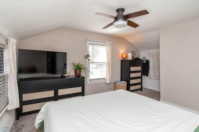 carpeted bedroom featuring vaulted ceiling and ceiling fan