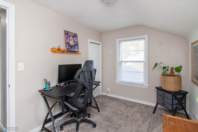 carpeted office featuring lofted ceiling