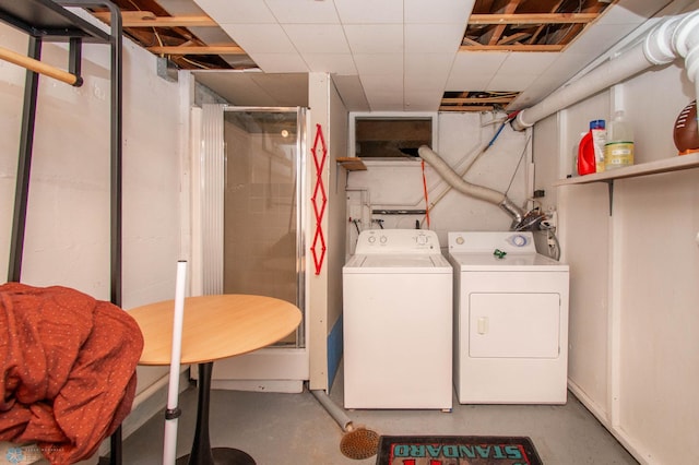 clothes washing area featuring washer and dryer