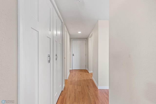 hall with light wood-type flooring