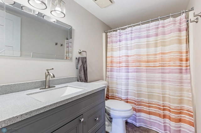 bathroom with vanity, toilet, and a shower with curtain