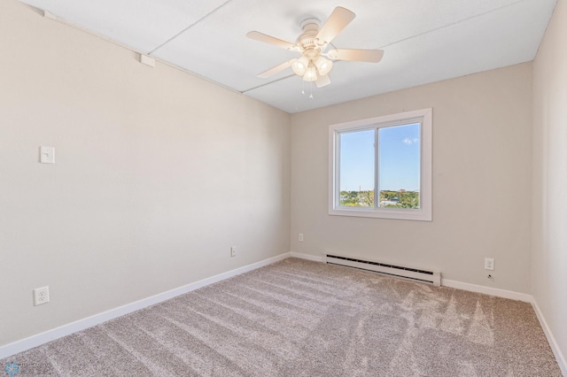 spare room with a baseboard heating unit, ceiling fan, and carpet flooring