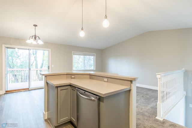 kitchen with gray cabinetry, vaulted ceiling, a kitchen island, pendant lighting, and an inviting chandelier