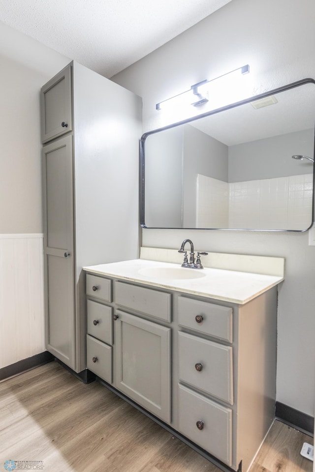 bathroom featuring vanity and hardwood / wood-style flooring