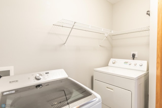 laundry room featuring washing machine and dryer