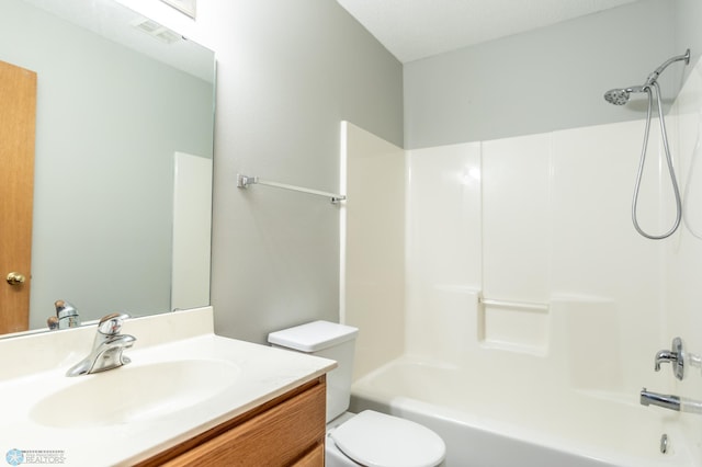 full bathroom featuring vanity, toilet, and  shower combination