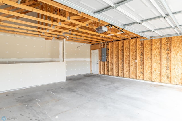 garage featuring a garage door opener and electric panel