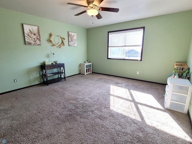 empty room with ceiling fan and carpet flooring