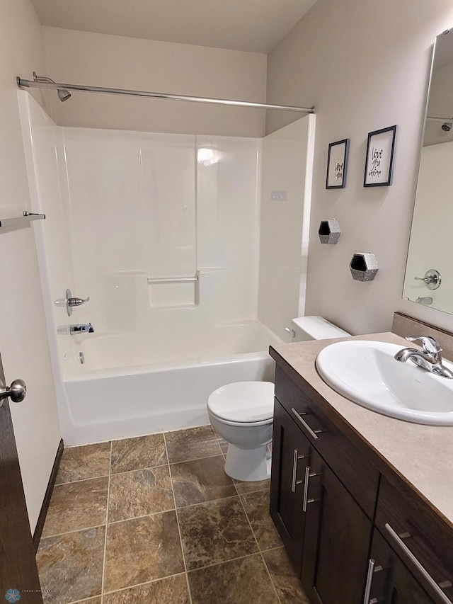 full bathroom with washtub / shower combination, vanity, and toilet