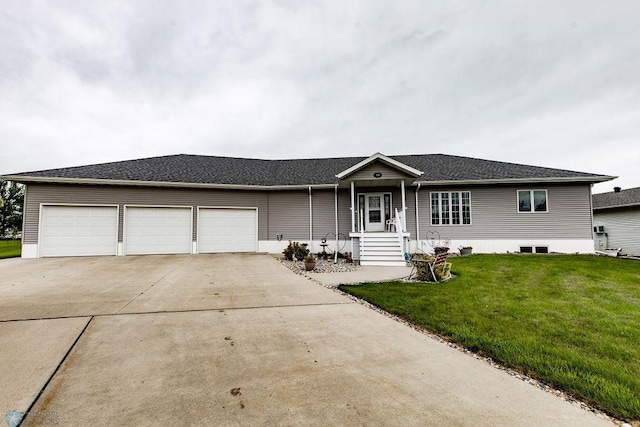 single story home with a front yard and a garage