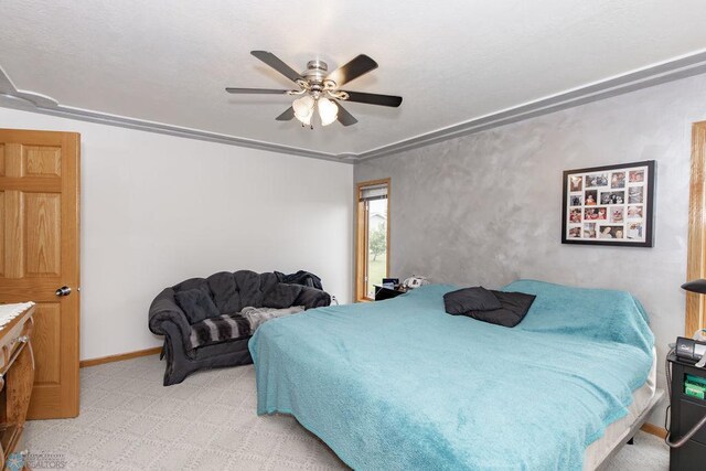 bedroom featuring light carpet and ceiling fan