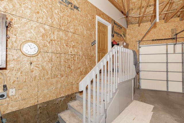 stairs featuring concrete floors