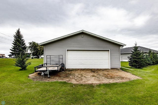 garage featuring a lawn